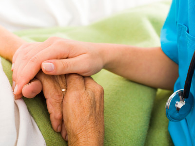 Nurses helping elderly