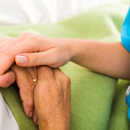 Nurses helping elderly